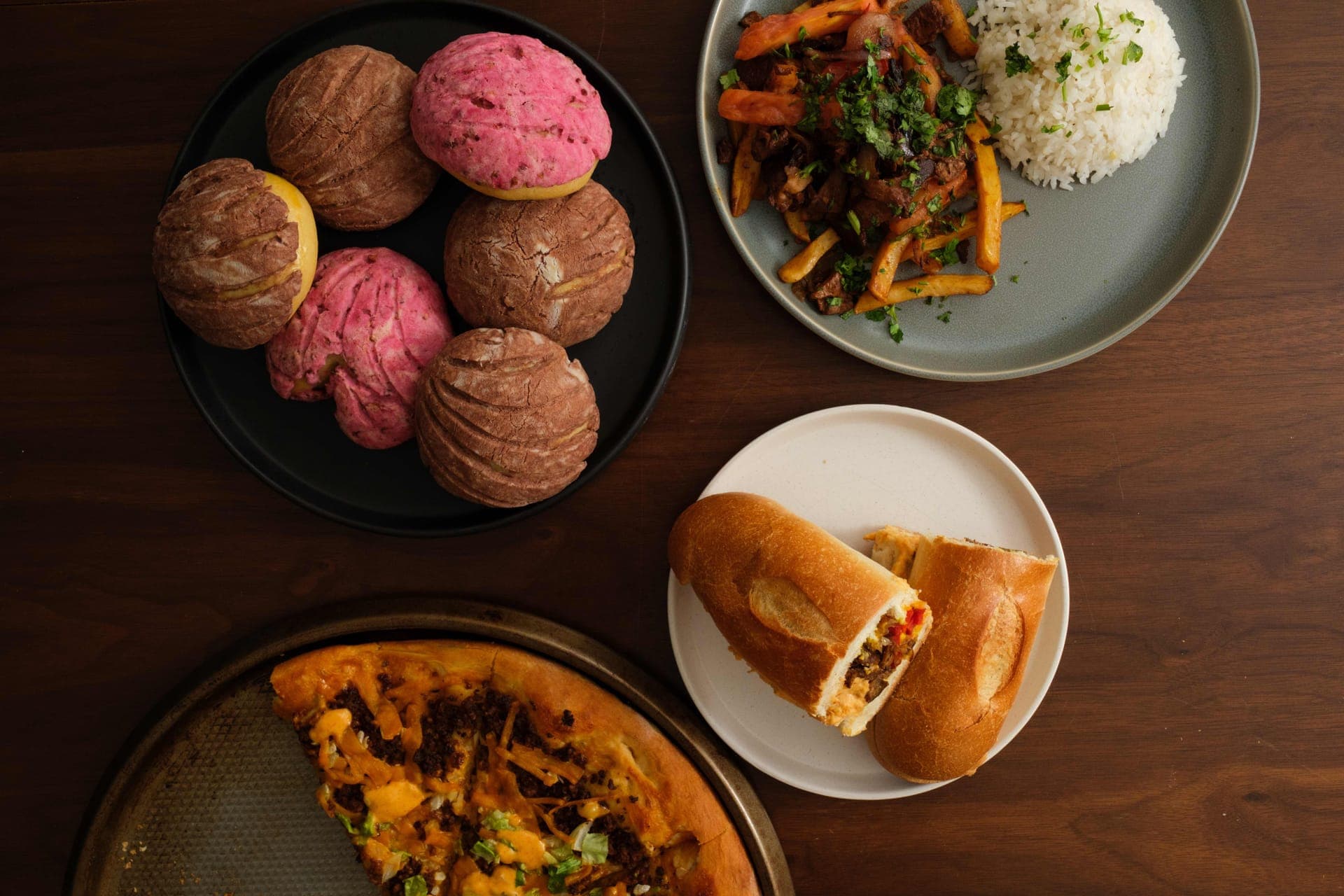 Colorful plant-based Latin-American dishes arranged on a rustic table