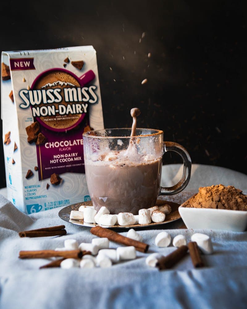 Swiss Miss hot chocolate box with mug topped with marshmallows