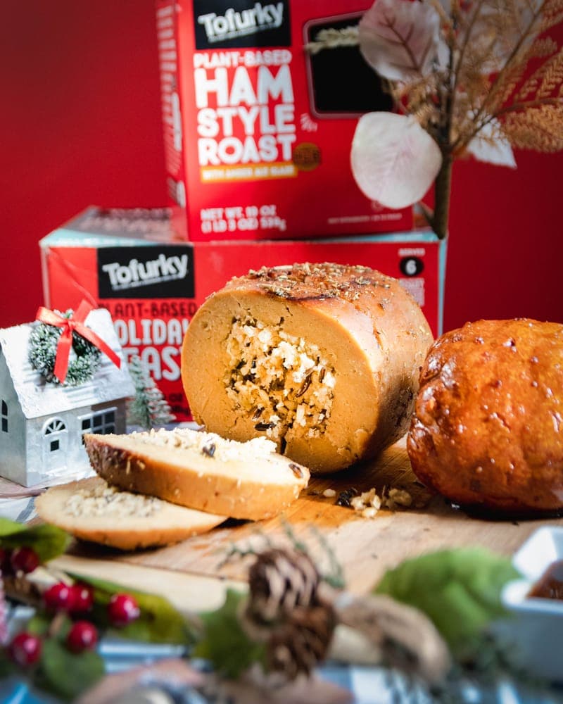 Tofurky holiday roast and ham products with festive decorations